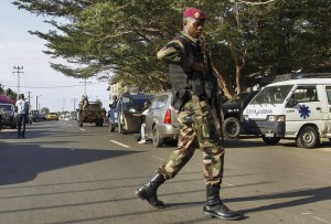 epa05210170 An Ivorian soldier secures the road outside of the 'Etoile du Sud' hotel in Grand Bassam, Ivory Coast, 13 March 2016. According to reports fourteen civilians and six assailants were killed when gunmen opened fire on guests at the 'Etoile du Sud' hotel in the town of Grand Bassam which is popular with foreigners.  EPA/LEGNAN KOULA